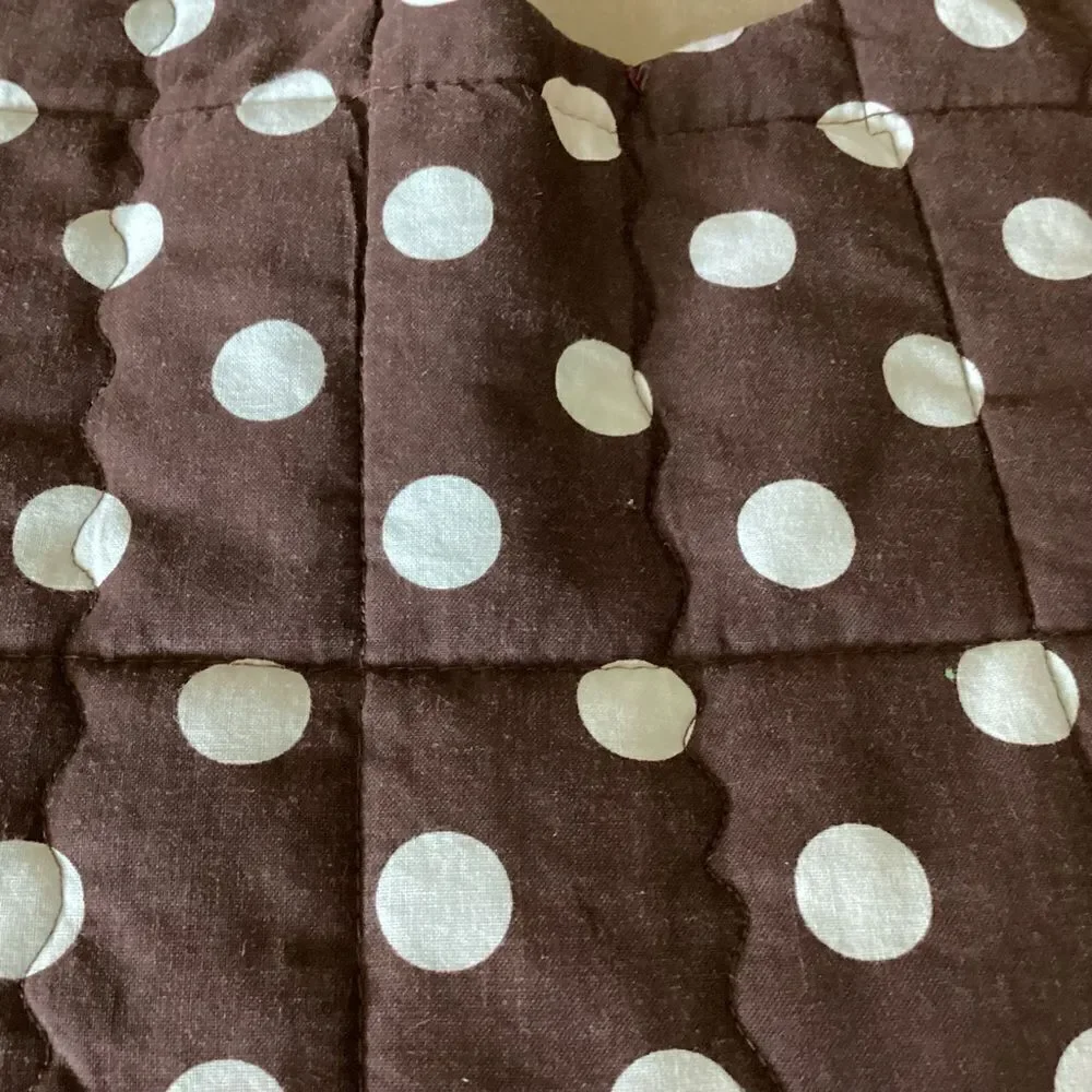 NWT. Hand, crafted baby bib in brown and green shirt plaids